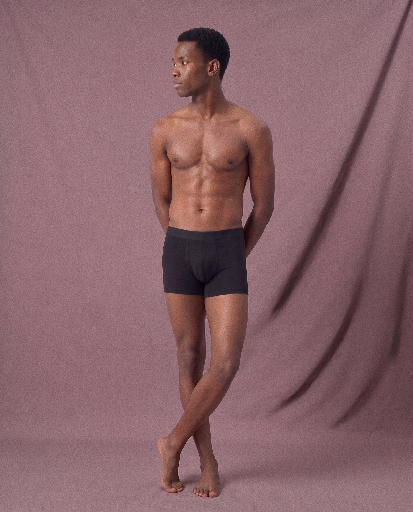Full-length model wearing black Frame underwear